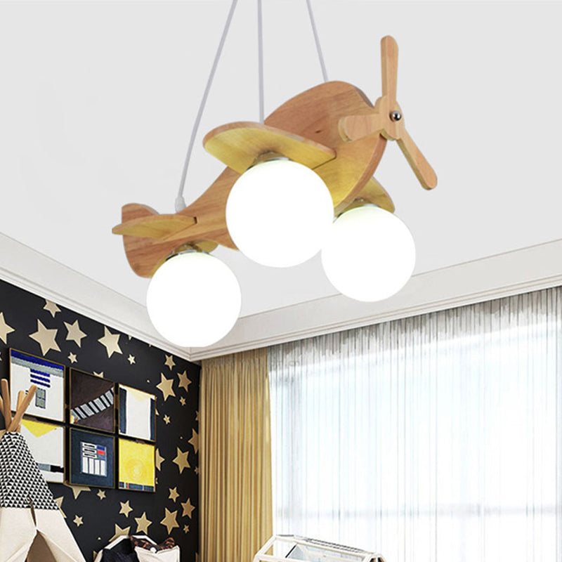 Creative Kids 3-Light Hanging Lamp Wood Plane Shaped Chandelier with Ball White Glass Shade Clearhalo 'Ceiling Lights' 'Chandeliers' Lighting' options 1909466