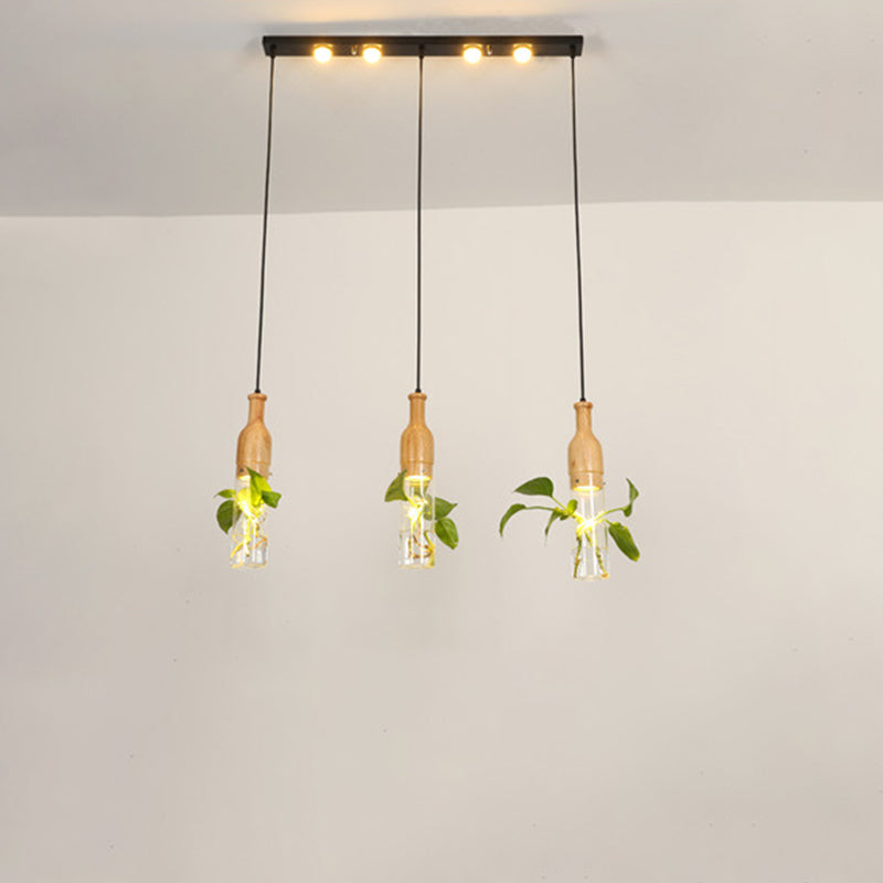 3/5 Lights Clear Glass Cluster Pendant Lodge Black Bottle Dining Room Ceiling Light with Round/Linear Canopy 3 Black Linear Clearhalo 'Ceiling Lights' 'Glass shade' 'Glass' 'Industrial Pendants' 'Industrial' 'Middle Century Pendants' 'Pendant Lights' 'Pendants' 'Tiffany' Lighting' 1911227