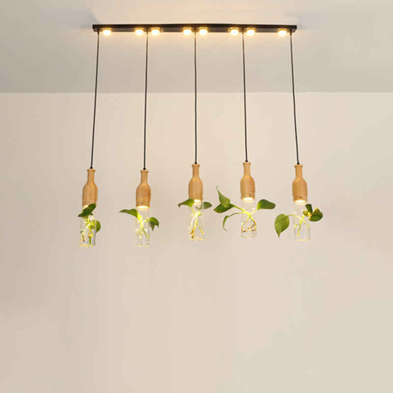 3/5 Lights Clear Glass Cluster Pendant Lodge Black Bottle Dining Room Ceiling Light with Round/Linear Canopy 5 Black Linear Clearhalo 'Ceiling Lights' 'Glass shade' 'Glass' 'Industrial Pendants' 'Industrial' 'Middle Century Pendants' 'Pendant Lights' 'Pendants' 'Tiffany' Lighting' 1911233