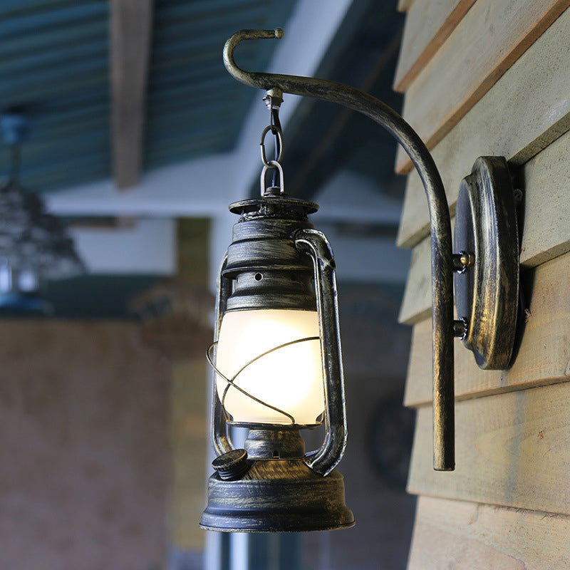 Bronze/Copper Single Wall Lamp Fixture Nautical Frosted Glass Kerosene Wall Lighting with Scroll Arm Bronze Clearhalo 'Art deco wall lights' 'Cast Iron' 'Glass' 'Industrial wall lights' 'Industrial' 'Middle century wall lights' 'Modern' 'Rustic wall lights' 'Tiffany' 'Traditional wall lights' 'Wall Lamps & Sconces' 'Wall Lights' Lighting' 1917173