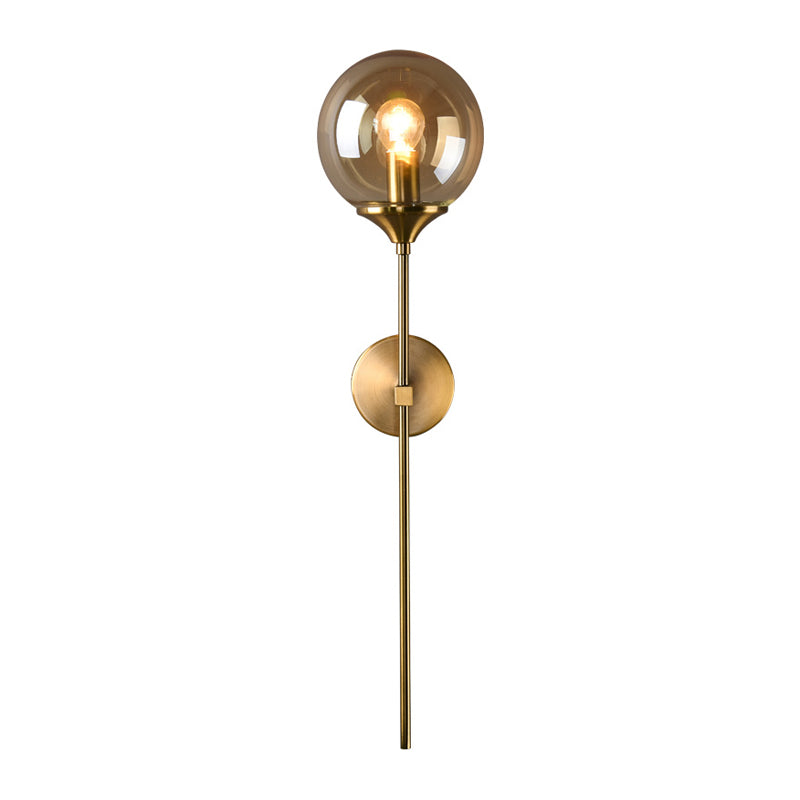 Ball Shade Pencil-Arm Wall Lighting Postmodern Clear/Amber/Smoke Grey Glass Single Brass Wall Mounted Lamp Clearhalo 'Cast Iron' 'Glass' 'Industrial' 'Modern wall lights' 'Modern' 'Tiffany' 'Traditional wall lights' 'Wall Lamps & Sconces' 'Wall Lights' Lighting' 1936534