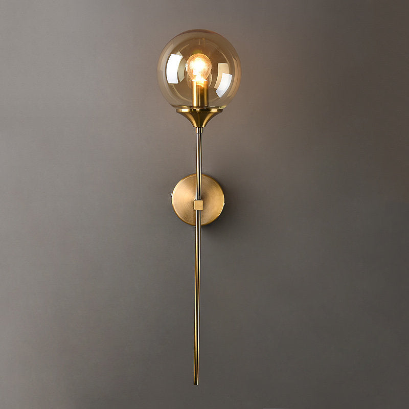 Ball Shade Pencil-Arm Wall Lighting Postmodern Clear/Amber/Smoke Grey Glass Single Brass Wall Mounted Lamp Clearhalo 'Cast Iron' 'Glass' 'Industrial' 'Modern wall lights' 'Modern' 'Tiffany' 'Traditional wall lights' 'Wall Lamps & Sconces' 'Wall Lights' Lighting' 1936535