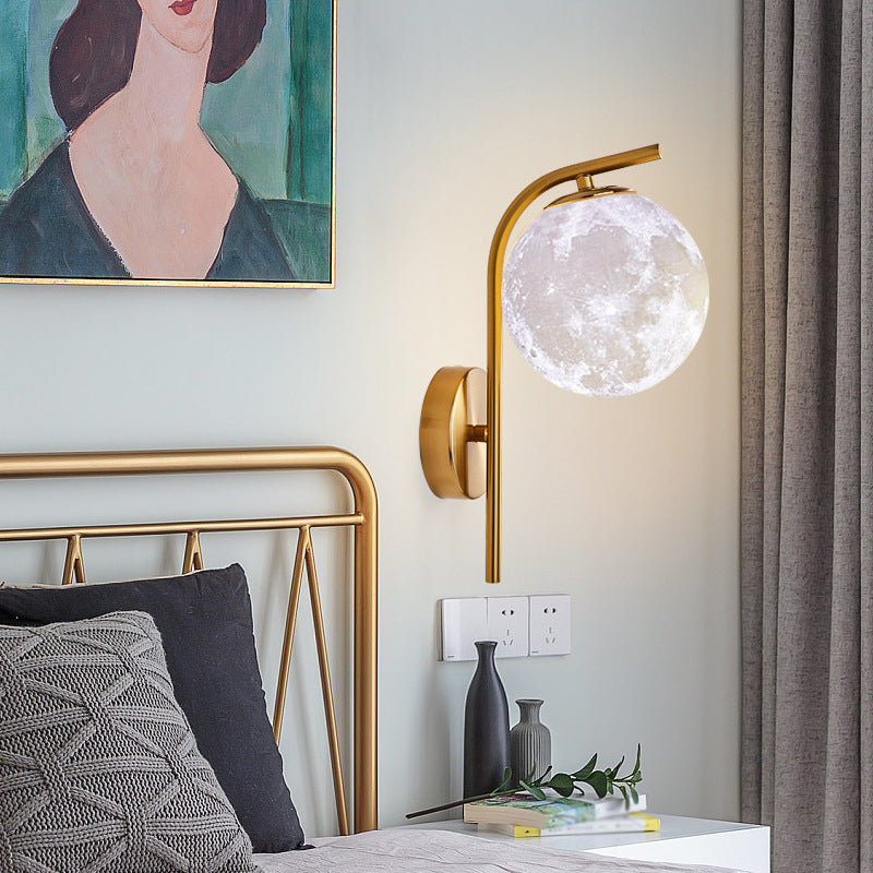 Postmodern Ball Wall Mount Light Grey/Clear Water/White Glass Single-Bulb Bedside Wall Lamp with Bent Arm in Brass Grey Clearhalo 'Cast Iron' 'Glass' 'Industrial' 'Modern wall lights' 'Modern' 'Tiffany' 'Traditional wall lights' 'Wall Lamps & Sconces' 'Wall Lights' Lighting' 1936614