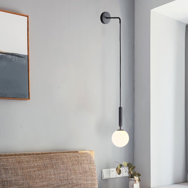 Spherical Bedside Wall Hanging Light Clear Water/White Glass Single Postmodern Wall Mounted Lamp in Black/Gold Black White Clearhalo 'Cast Iron' 'Glass' 'Industrial' 'Modern wall lights' 'Modern' 'Tiffany' 'Traditional wall lights' 'Wall Lamps & Sconces' 'Wall Lights' Lighting' 1936643