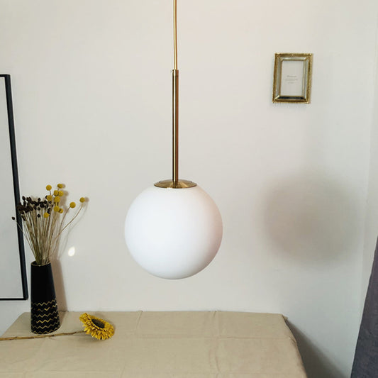 Simple Ball Shaped Drop Pendant White Glass 1 Light 6"/8"/10" Dia Bedroom Pendulum Light in Brass Clearhalo 'Ceiling Lights' 'Modern Pendants' 'Modern' 'Pendant Lights' 'Pendants' Lighting' 1936787