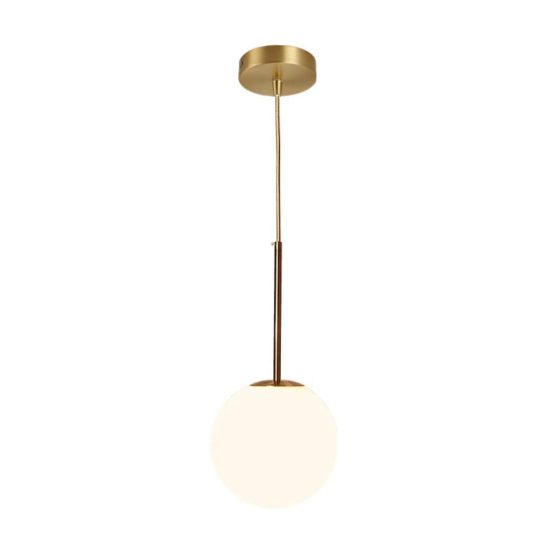 Simple Ball Shaped Drop Pendant White Glass 1 Light 6"/8"/10" Dia Bedroom Pendulum Light in Brass Clearhalo 'Ceiling Lights' 'Modern Pendants' 'Modern' 'Pendant Lights' 'Pendants' Lighting' 1936788