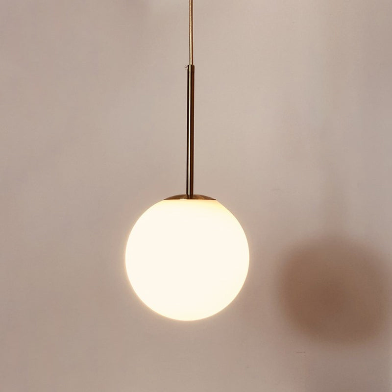 Simple Ball Shaped Drop Pendant White Glass 1 Light 6"/8"/10" Dia Bedroom Pendulum Light in Brass Clearhalo 'Ceiling Lights' 'Modern Pendants' 'Modern' 'Pendant Lights' 'Pendants' Lighting' 1936789