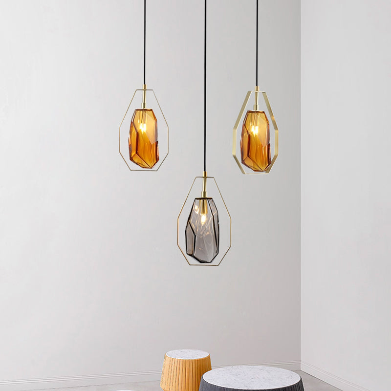 Gem Amber/Smoke Grey Glass Hanging Lamp Postmodernist 1 Light Brass Ceiling Pendant with Heptagon Frame Smoke Gray Clearhalo 'Ceiling Lights' 'Glass shade' 'Glass' 'Modern Pendants' 'Modern' 'Pendant Lights' 'Pendants' Lighting' 1937305