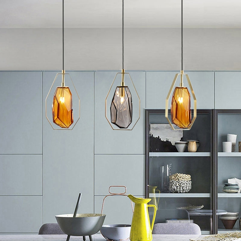 Gem Amber/Smoke Grey Glass Hanging Lamp Postmodernist 1 Light Brass Ceiling Pendant with Heptagon Frame Amber Clearhalo 'Ceiling Lights' 'Glass shade' 'Glass' 'Modern Pendants' 'Modern' 'Pendant Lights' 'Pendants' Lighting' 1937310