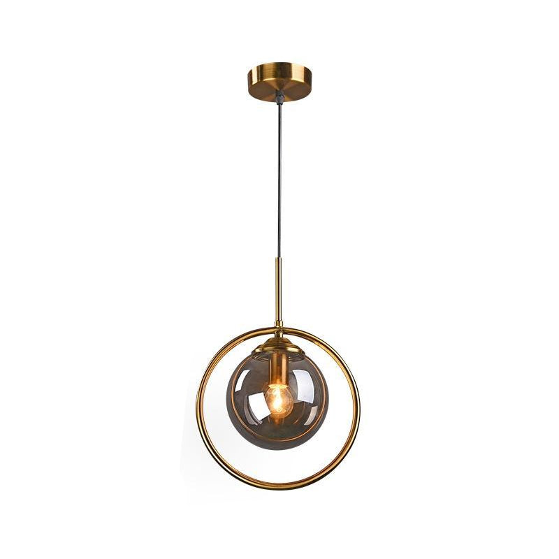 Globe Down Lighting Pendant Postmodern Clear/Amber/Smoke Grey Glass Single-Bulb Bedroom Suspension Light with Brass Ring Clearhalo 'Ceiling Lights' 'Glass shade' 'Glass' 'Modern Pendants' 'Modern' 'Pendant Lights' 'Pendants' Lighting' 1937400