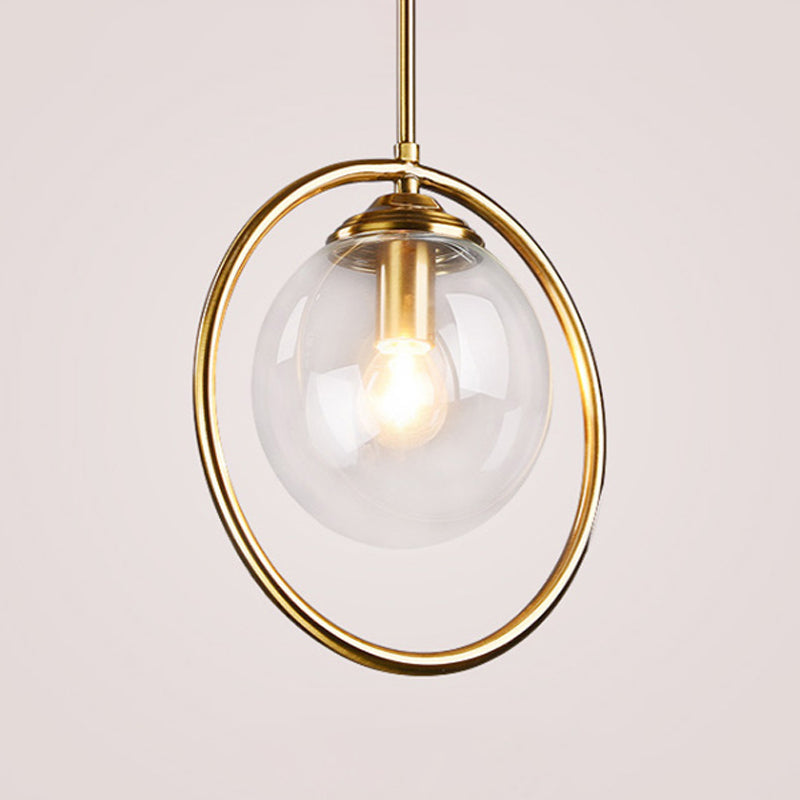Globe Down Lighting Pendant Postmodern Clear/Amber/Smoke Grey Glass Single-Bulb Bedroom Suspension Light with Brass Ring Clearhalo 'Ceiling Lights' 'Glass shade' 'Glass' 'Modern Pendants' 'Modern' 'Pendant Lights' 'Pendants' Lighting' 1937409