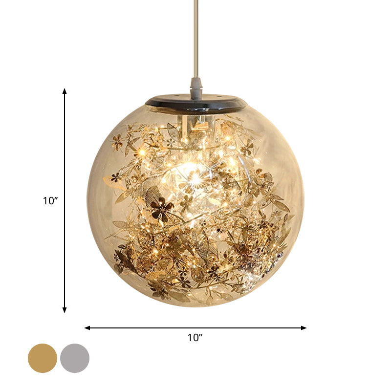 Globe Clear Glass Pendulum Light Modern 1 Head Silver/Gold Ceiling Hang Lamp with Scattered Flower Decor Clearhalo 'Ceiling Lights' 'Glass shade' 'Glass' 'Modern Pendants' 'Modern' 'Pendant Lights' 'Pendants' Lighting' 1937442