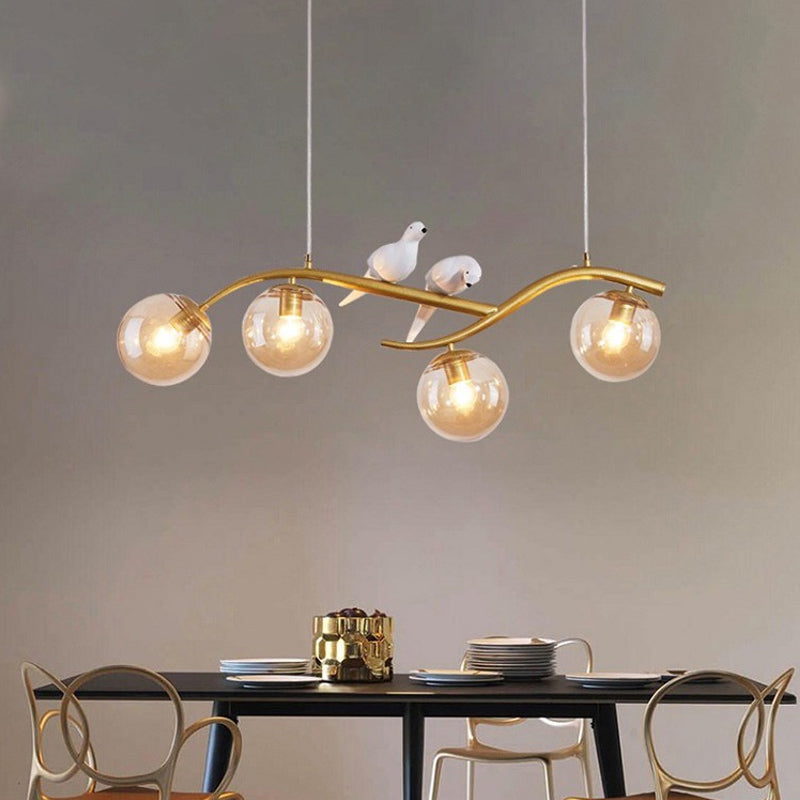 Metal Branch Hanging Lamp Contemporary 4-Light Black/Gold Island Pendant with Bird Deco and Smoke Grey/Cognac Glass Shade Gold Cognac Clearhalo 'Ceiling Lights' 'Glass shade' 'Glass' 'Island Lights' Lighting' 1937741