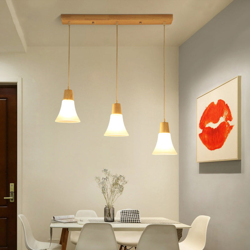 Bell/Bowl/Barrel Ceiling Hang Lamp Nordic Ivory Glass 3-Head Dining Room Round/Linear-Canopy Cluster Pendant in Wood Wood Bell Linear Clearhalo 'Ceiling Lights' 'Modern Pendants' 'Modern' 'Pendant Lights' 'Pendants' Lighting' 1949030