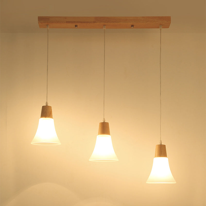 Bell/Bowl/Barrel Ceiling Hang Lamp Nordic Ivory Glass 3-Head Dining Room Round/Linear-Canopy Cluster Pendant in Wood Clearhalo 'Ceiling Lights' 'Modern Pendants' 'Modern' 'Pendant Lights' 'Pendants' Lighting' 1949031