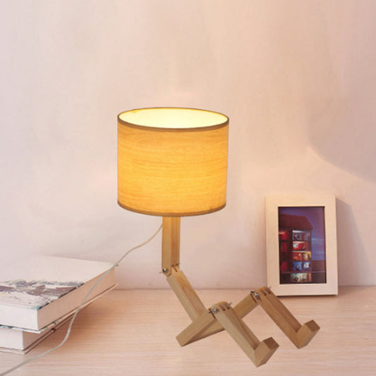 Man-Shaped Table Lamp Novelty Modern Wood Single Beige/Black/White Night Light with Book Rack Design and Cylinder Fabric Shade Clearhalo 'Lamps' 'Table Lamps' Lighting' 1949329