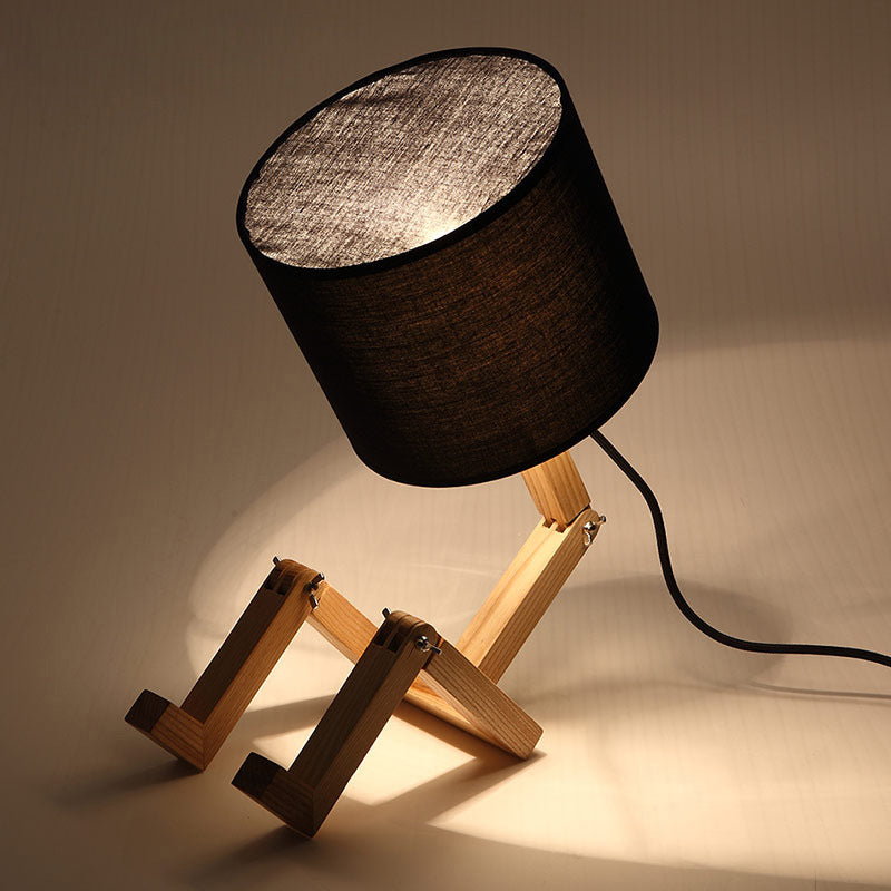 Man-Shaped Table Lamp Novelty Modern Wood Single Beige/Black/White Night Light with Book Rack Design and Cylinder Fabric Shade Black Clearhalo 'Lamps' 'Table Lamps' Lighting' 1949335
