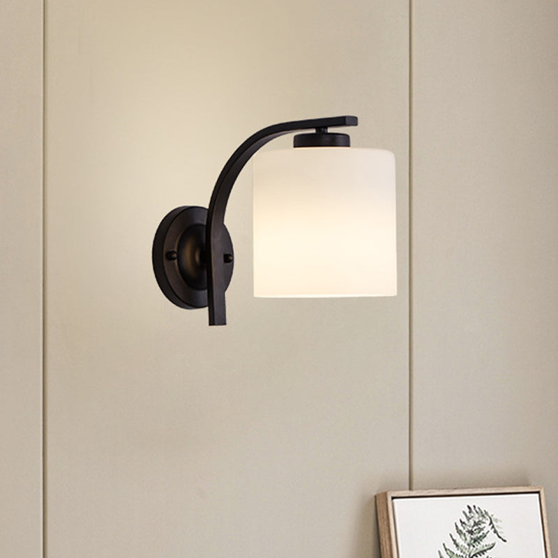 Black 1-Light Wall Sconce Simple Ivory Glass Cylinder Wall Mounted Lamp with Curved Arm Clearhalo 'Wall Lamps & Sconces' 'Wall Lights' Lighting' 1960423