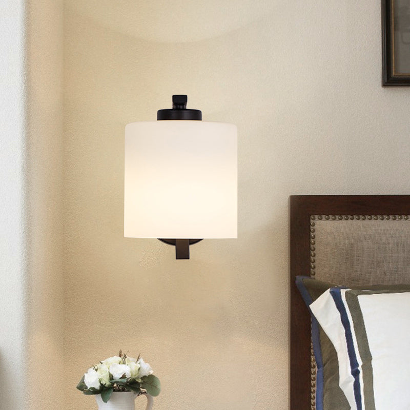 Black 1-Light Wall Sconce Simple Ivory Glass Cylinder Wall Mounted Lamp with Curved Arm Clearhalo 'Wall Lamps & Sconces' 'Wall Lights' Lighting' 1960424