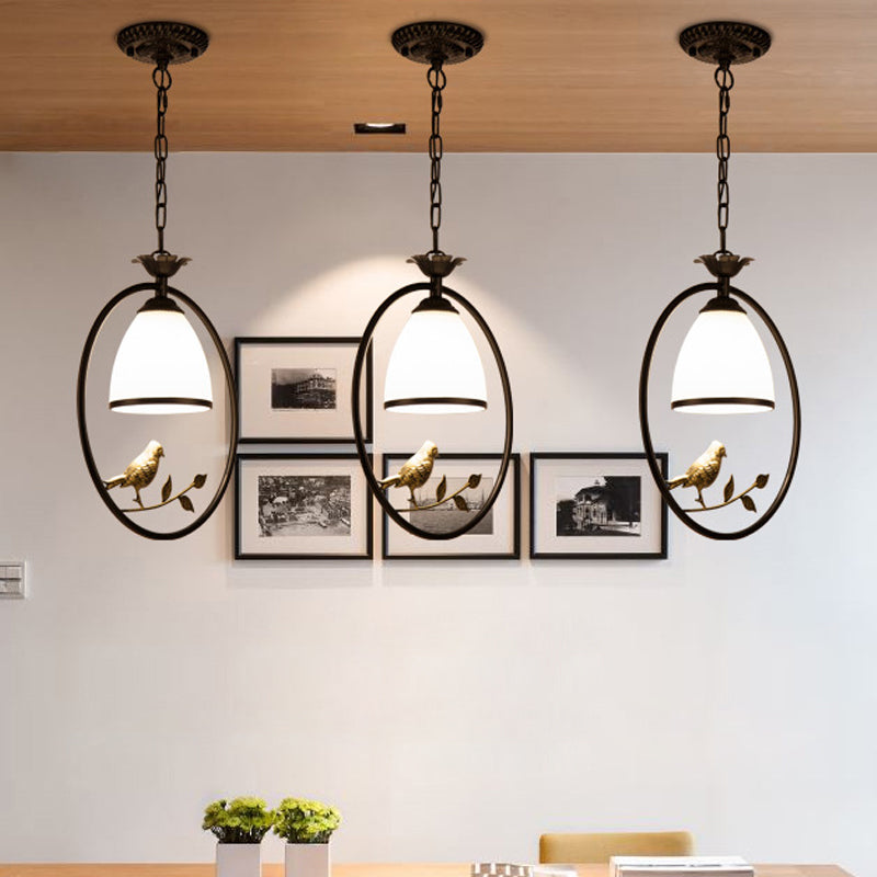 Rustic Oval/Round Pendulum Light 1 Bulb Metal Pendant Lamp in Black with Bell White Glass Shade and Bird Decoration Clearhalo 'Ceiling Lights' 'Pendant Lights' 'Pendants' Lighting' 1972267