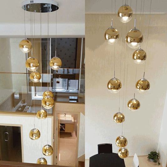 Globe Cluster Pendant Light Nordic Aluminum Stairs Suspension Lighting with Clear Glass Bottom in Gold Clearhalo 'Ceiling Lights' 'Glass shade' 'Glass' 'Modern Pendants' 'Modern' 'Pendant Lights' 'Pendants' Lighting' 2025345