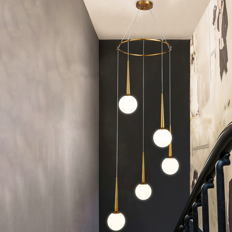 Milky Glass Ball Cluster Pendant Modern Style Hanging Light Fixture with Metal Ring Top 5 Gold Clearhalo 'Ceiling Lights' 'Modern Pendants' 'Modern' 'Pendant Lights' 'Pendants' Lighting' 2025365