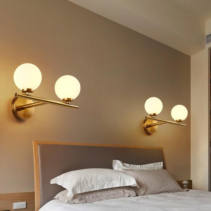 Spherical Wall Lighting Contemporary White Glass Bedside Wall Light Fixture in Gold Clearhalo 'Cast Iron' 'Glass' 'Industrial' 'Modern wall lights' 'Modern' 'Tiffany' 'Traditional wall lights' 'Wall Lamps & Sconces' 'Wall Lights' Lighting' 2038856