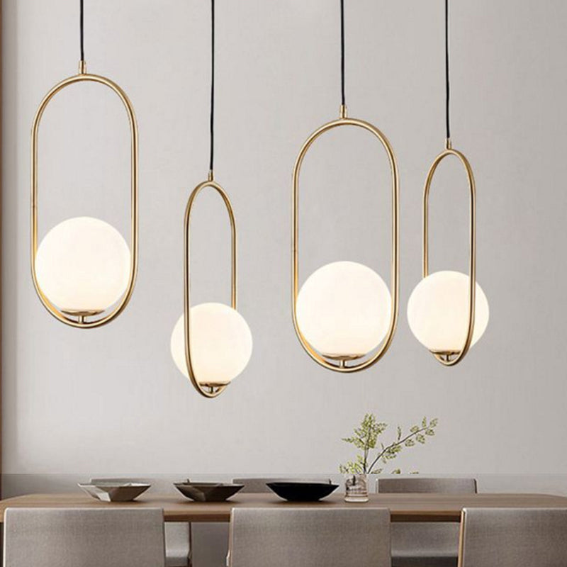 Opal Glass Globe Drop Pendant Modern 1-Bulb Gold Hanging Light Kit with Oval Frame Clearhalo 'Ceiling Lights' 'Glass shade' 'Glass' 'Modern Pendants' 'Modern' 'Pendant Lights' 'Pendants' Lighting' 2038990