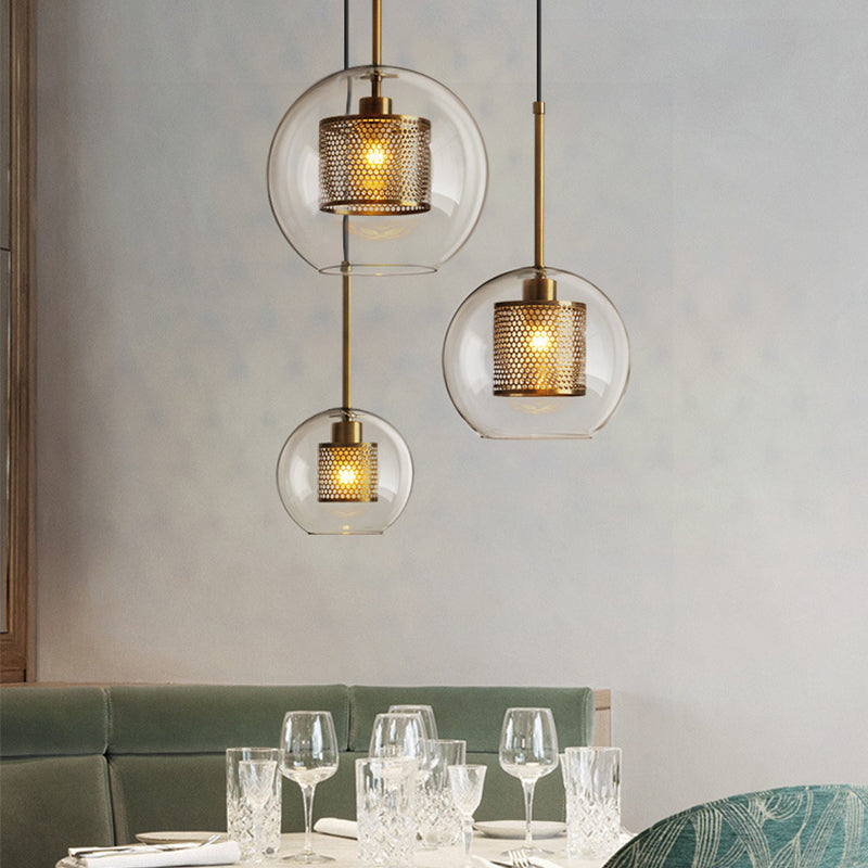 Clear Glass Orb Pendant Lighting Modernity 1 Head Hanging Ceiling Light with Inside Mesh Cage Bronze A Clearhalo 'Ceiling Lights' 'Glass shade' 'Glass' 'Modern Pendants' 'Modern' 'Pendant Lights' 'Pendants' Lighting' 2039044