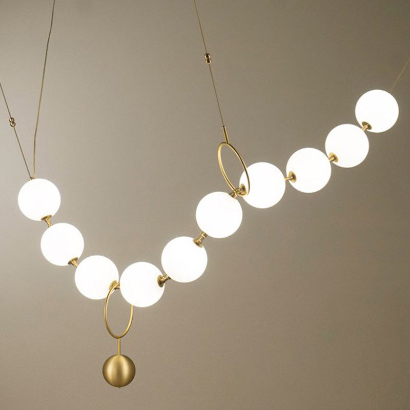 Round Hanging Ceiling Light Nordic Opal Glass 10-Light Dining Room Chandelier Lighting Fixture with Necklace Design in Gold Clearhalo 'Ceiling Lights' 'Chandeliers' 'Glass shade' 'Glass' 'Modern Chandeliers' 'Modern' Lighting' 2039407
