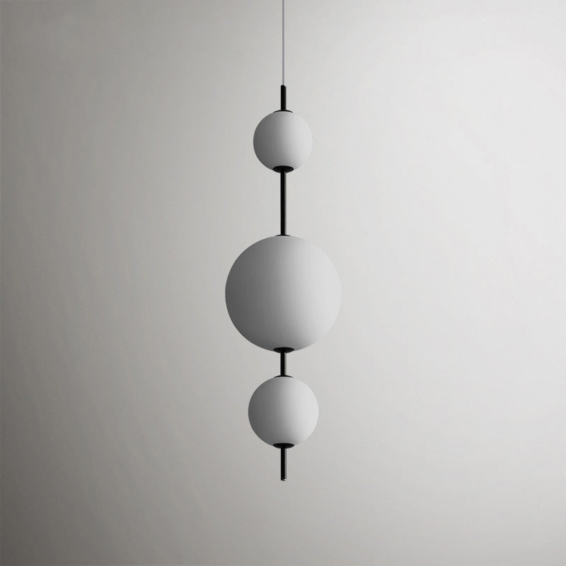 Ball Dining Room Pendulum Light Cream Glass LED Modernity Chandelier Lighting Fixture in Black Black A Clearhalo 'Ceiling Lights' 'Chandeliers' 'Glass shade' 'Glass' 'Modern Chandeliers' 'Modern' Lighting' 2039432
