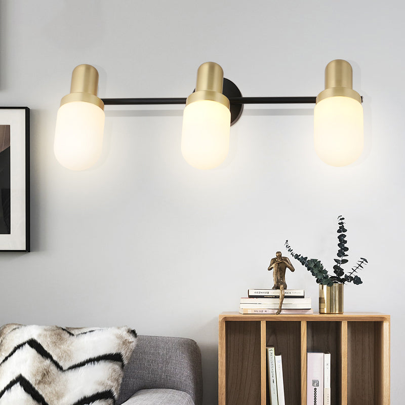 Modern Capsule Glass Sconce Light 1/2/3 Lights Wall Mount Light with Black Arm and Backplate 3.0 Black Clearhalo 'Cast Iron' 'Glass' 'Industrial' 'Modern wall lights' 'Modern' 'Tiffany' 'Traditional wall lights' 'Wall Lamps & Sconces' 'Wall Lights' Lighting' 210117