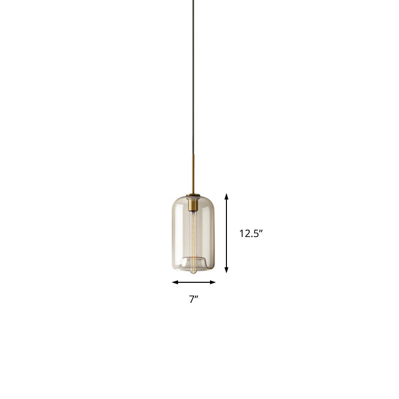 1 Light Dining Room Suspension Lamp with Oval/Drum/Cylinder Clear Glass Shade Contemporary Brass Ceiling Pendant Light, 7"/10"/11" Wide Clearhalo 'Ceiling Lights' 'Glass shade' 'Glass' 'Modern Pendants' 'Modern' 'Pendant Lights' 'Pendants' Lighting' 211131