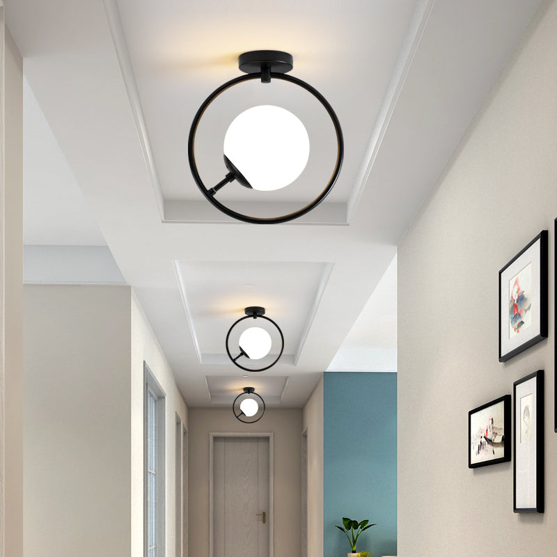 Sphere Semi Flush Mount Modernist White/Yellow Glass 1 Light Black Semi Flush Mount Light Fixture with Iron Ring Clearhalo 'Ceiling Lights' 'Close To Ceiling Lights' 'Close to ceiling' 'Glass shade' 'Glass' 'Semi-flushmount' Lighting' 212398
