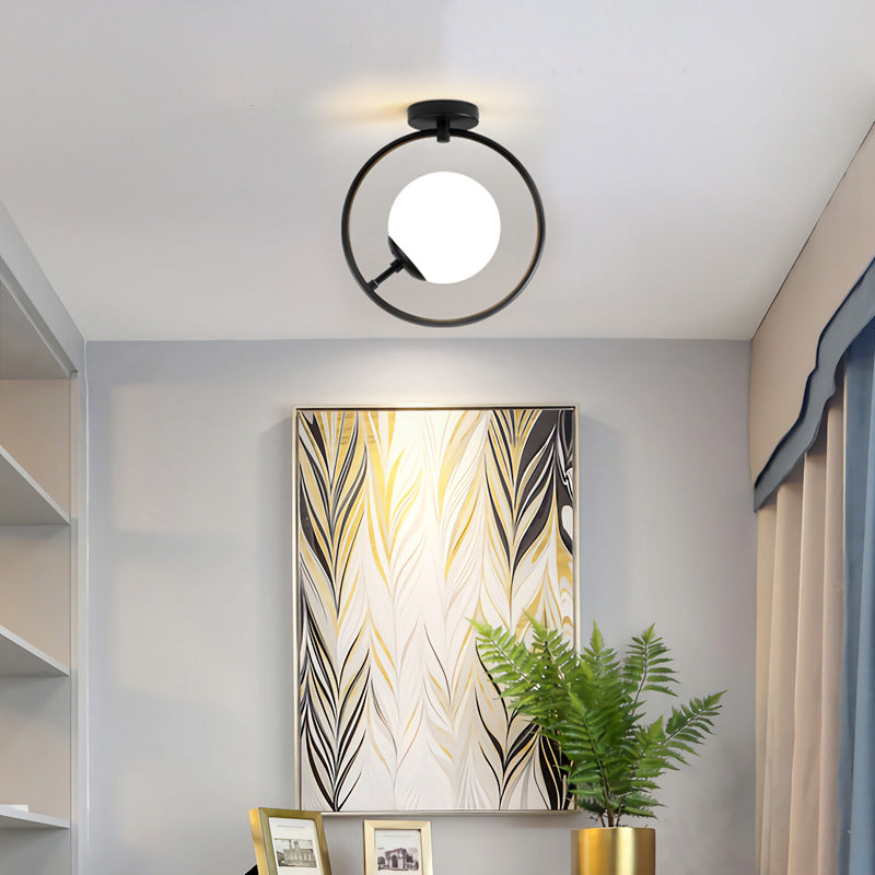 Sphere Semi Flush Mount Modernist White/Yellow Glass 1 Light Black Semi Flush Mount Light Fixture with Iron Ring Clearhalo 'Ceiling Lights' 'Close To Ceiling Lights' 'Close to ceiling' 'Glass shade' 'Glass' 'Semi-flushmount' Lighting' 212399