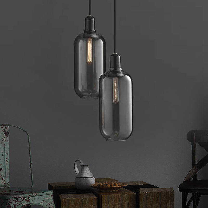 Modernist Cylinder Pendant Amber/Smoky Glass 1 Light Living Room Hanging Ceiling Lamp, 4"/5.5" Wide Smoke Gray 4" Clearhalo 'Ceiling Lights' 'Close To Ceiling Lights' 'Glass shade' 'Glass' 'Modern Pendants' 'Modern' 'Pendant Lights' 'Pendants' Lighting' 212974