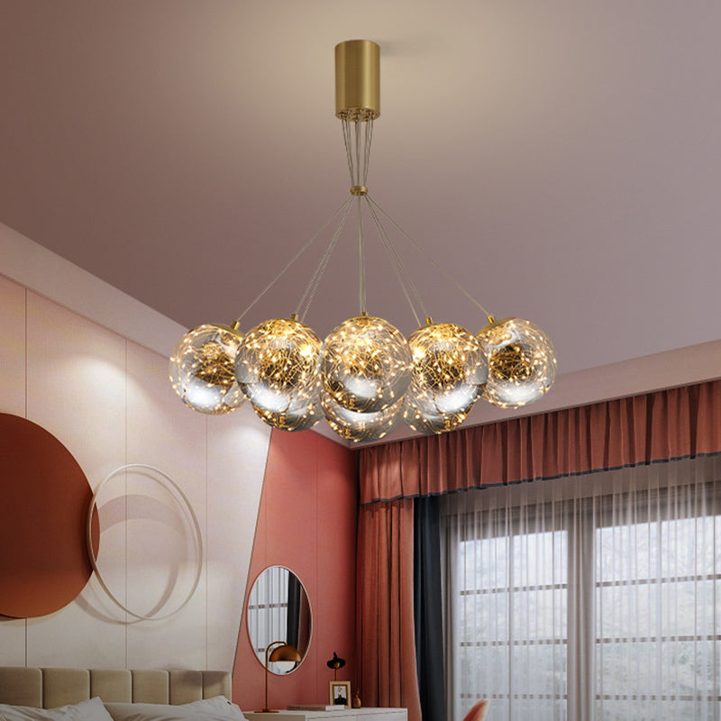 Sphere Handblown Glass LED Multi Light Pendant Modern Brass Starry Hanging Lighting 9 Brass Clearhalo 'Ceiling Lights' 'Modern Pendants' 'Modern' 'Pendant Lights' 'Pendants' Lighting' 2162526