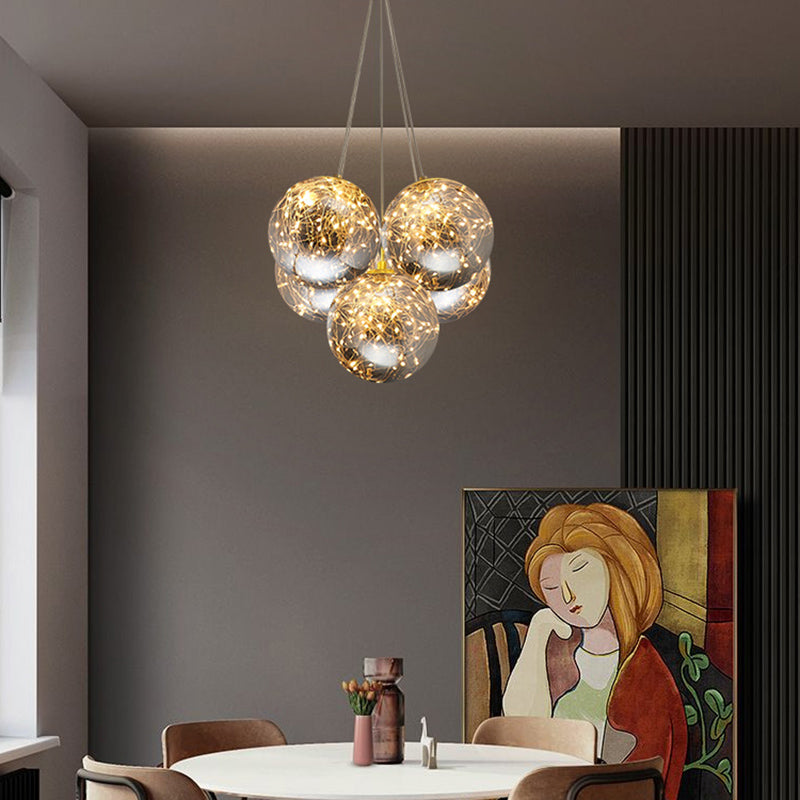 Sphere Handblown Glass LED Multi Light Pendant Modern Brass Starry Hanging Lighting 5 Brass Clearhalo 'Ceiling Lights' 'Modern Pendants' 'Modern' 'Pendant Lights' 'Pendants' Lighting' 2162530