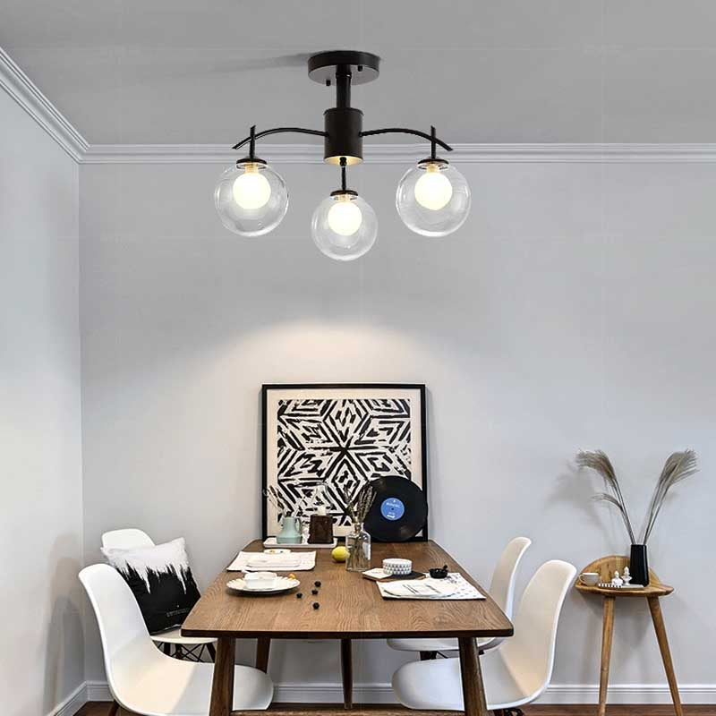 Clear Glass Ball Semi Flush Light Contemporary 3/5/6-Light Living Room Ceiling Flush Mount Chandelier in Black 3 Black Clearhalo 'Ceiling Lights' 'Close To Ceiling Lights' 'Close to ceiling' 'Glass shade' 'Glass' 'Semi-flushmount' Lighting' 219015