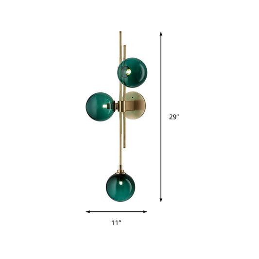 Green/Clear Glass Globe Wall Sconce Lamp Contemporary 3 Lights Wall Light Fixture in Brass Clearhalo 'Cast Iron' 'Glass' 'Industrial' 'Modern wall lights' 'Modern' 'Tiffany' 'Traditional wall lights' 'Wall Lamps & Sconces' 'Wall Lights' Lighting' 219642