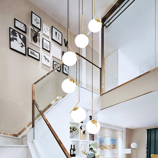 Ball Shade Hanging Lighting Simplicity Opal Glass Staircase Multi Light Pendant in Gold Gold Clearhalo 'Ceiling Lights' 'Glass shade' 'Glass' 'Modern Pendants' 'Modern' 'Pendant Lights' 'Pendants' Lighting' 2197477