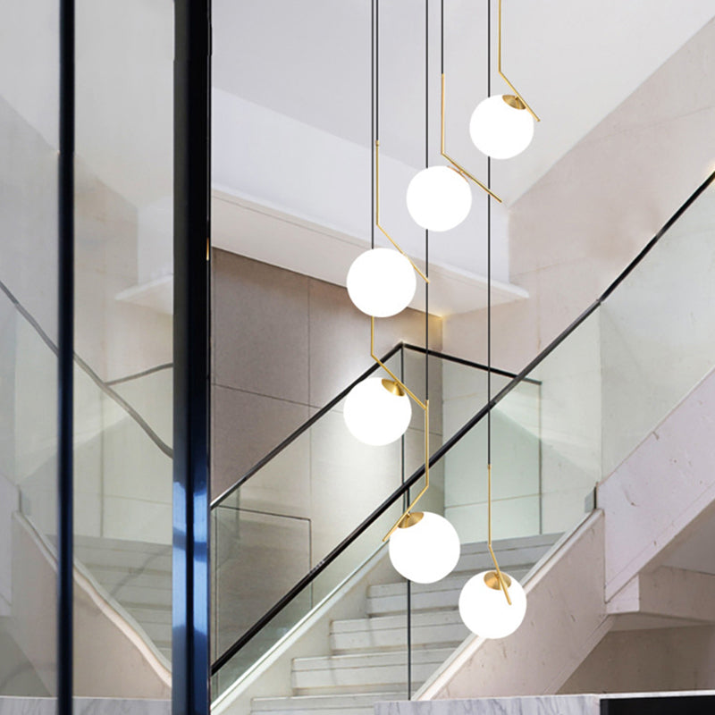 Ball Shade Hanging Lighting Simplicity Opal Glass Staircase Multi Light Pendant in Gold Clearhalo 'Ceiling Lights' 'Glass shade' 'Glass' 'Modern Pendants' 'Modern' 'Pendant Lights' 'Pendants' Lighting' 2197478