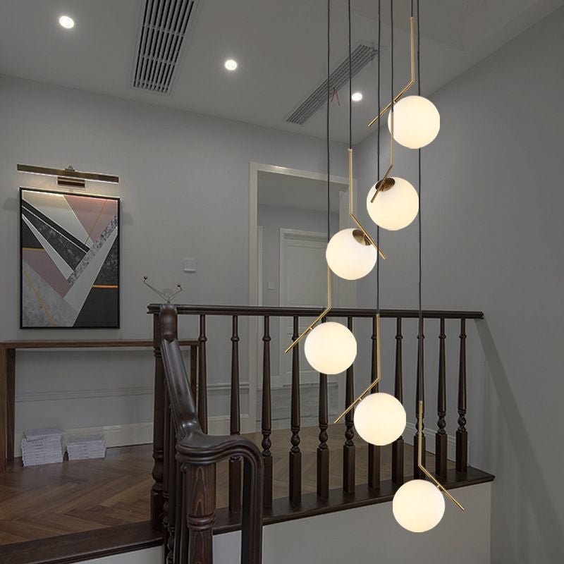 Ball Shade Hanging Lighting Simplicity Opal Glass Staircase Multi Light Pendant in Gold Clearhalo 'Ceiling Lights' 'Glass shade' 'Glass' 'Modern Pendants' 'Modern' 'Pendant Lights' 'Pendants' Lighting' 2197479