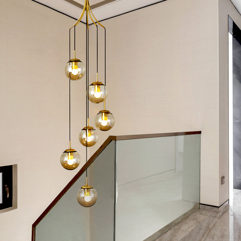 Globe Staircase Multi Ceiling Lamp Frost Glass Contemporary Suspension Light Fixture in Gold 6 Gold Clearhalo 'Ceiling Lights' 'Glass shade' 'Glass' 'Modern Pendants' 'Modern' 'Pendant Lights' 'Pendants' Lighting' 2197508
