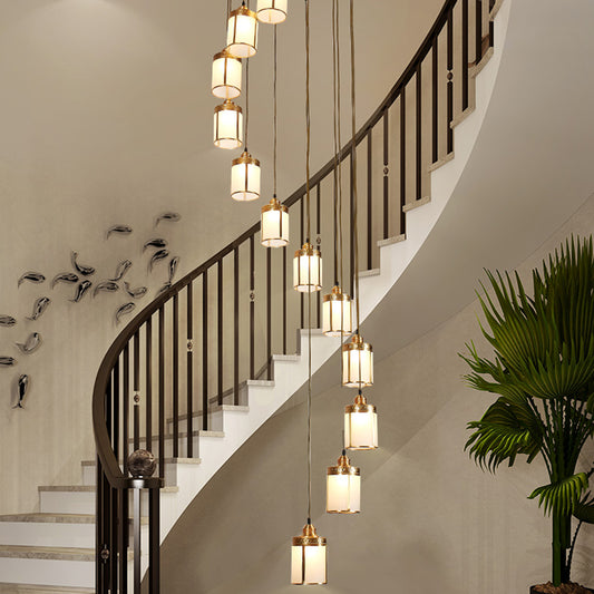 Artistic Cylindrical Multi Ceiling Light Frost Glass Staircase Suspension Lighting in Brass 12 Brass Clearhalo 'Ceiling Lights' 'Glass shade' 'Glass' 'Modern Pendants' 'Modern' 'Pendant Lights' 'Pendants' Lighting' 2197646