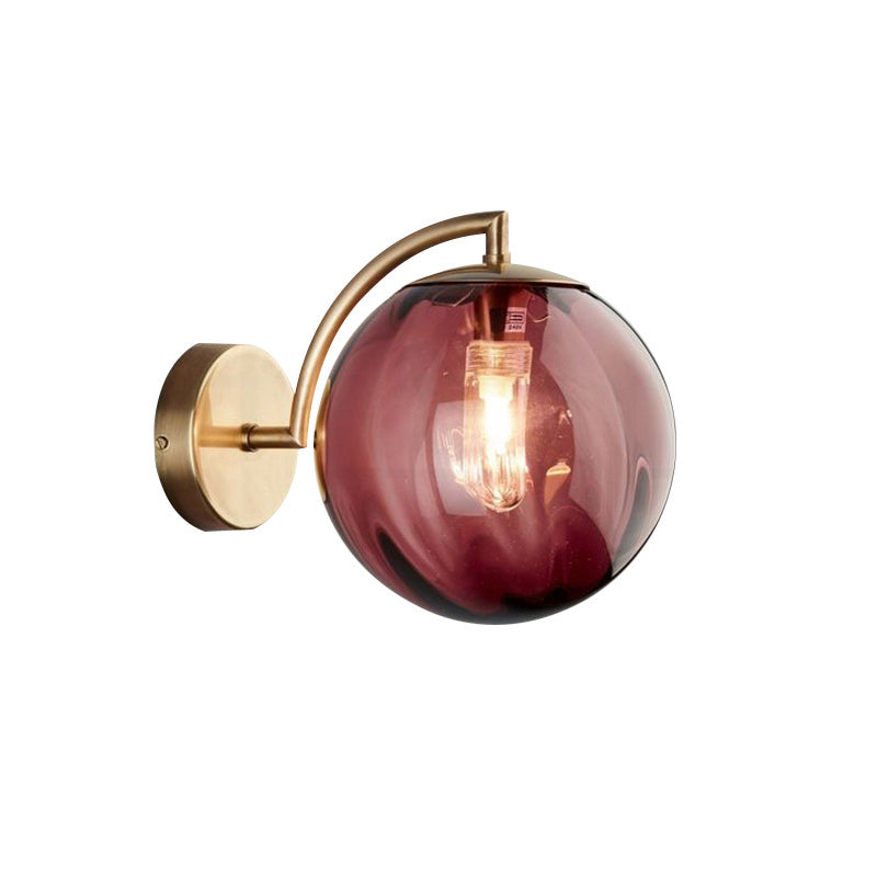 Postmodernist Brass Armed Ball Sconce Lamp Red/Blue/Amber Glass Single Light Wall Lighting Fixture Clearhalo 'Cast Iron' 'Glass' 'Industrial' 'Modern wall lights' 'Modern' 'Tiffany' 'Traditional wall lights' 'Wall Lamps & Sconces' 'Wall Lights' Lighting' 219788