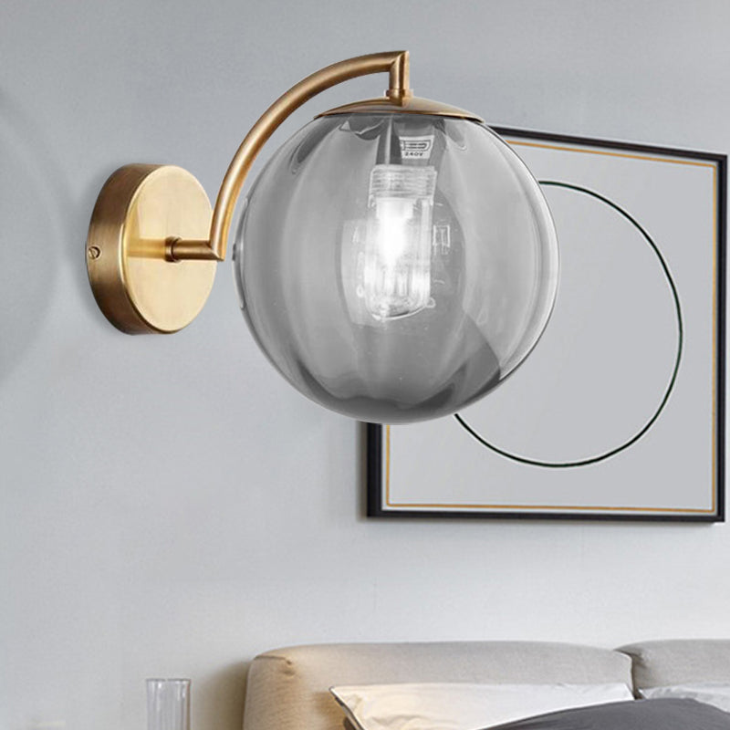 Postmodernist Brass Armed Ball Sconce Lamp Red/Blue/Amber Glass Single Light Wall Lighting Fixture Smoke Gray Clearhalo 'Cast Iron' 'Glass' 'Industrial' 'Modern wall lights' 'Modern' 'Tiffany' 'Traditional wall lights' 'Wall Lamps & Sconces' 'Wall Lights' Lighting' 219792