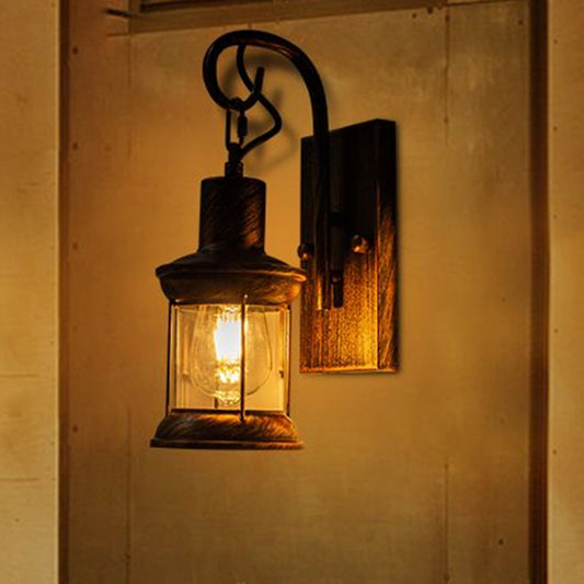 Iron Lantern Wall Light Retro Style Single-Bulb Restaurant Wall Lighting Fixture in Bronze Bronze Clearhalo 'Art deco wall lights' 'Cast Iron' 'Glass' 'Industrial wall lights' 'Industrial' 'Middle century wall lights' 'Modern' 'Rustic wall lights' 'Tiffany' 'Traditional wall lights' 'Wall Lamps & Sconces' 'Wall Lights' Lighting' 2216675