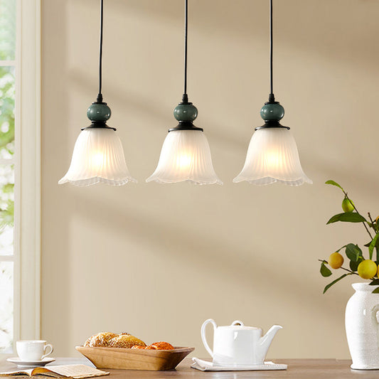 3 Bulbs Multi Light Pendant Retro Style Floral Shade Ribbed Ruffled Glass Hanging Lighting in Black Black Linear Clearhalo 'Ceiling Lights' 'Glass shade' 'Glass' 'Pendant Lights' 'Pendants' Lighting' 2216734