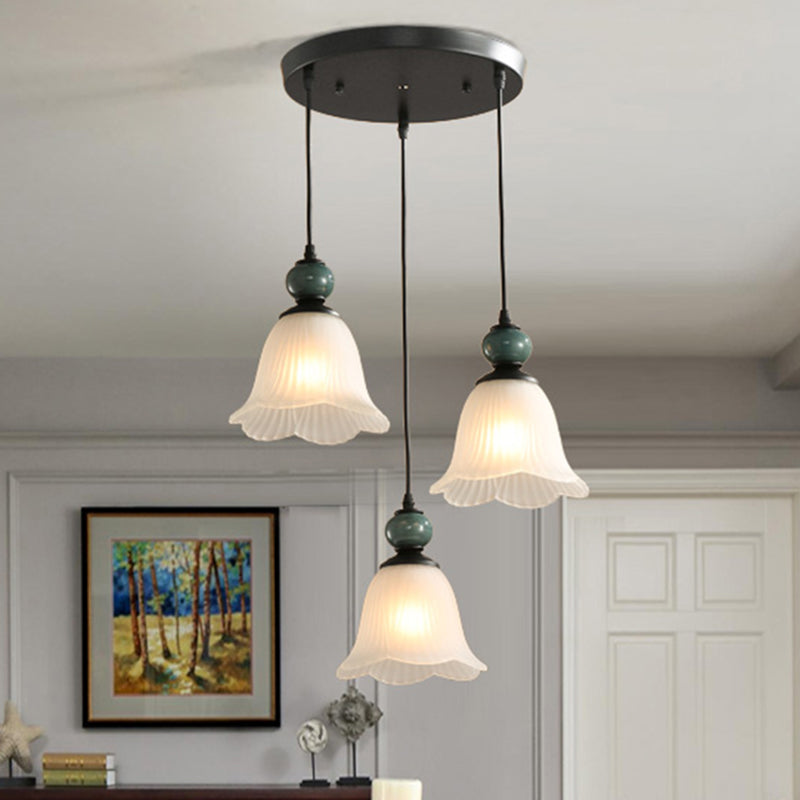 3 Bulbs Multi Light Pendant Retro Style Floral Shade Ribbed Ruffled Glass Hanging Lighting in Black Black Round Clearhalo 'Ceiling Lights' 'Glass shade' 'Glass' 'Pendant Lights' 'Pendants' Lighting' 2216736